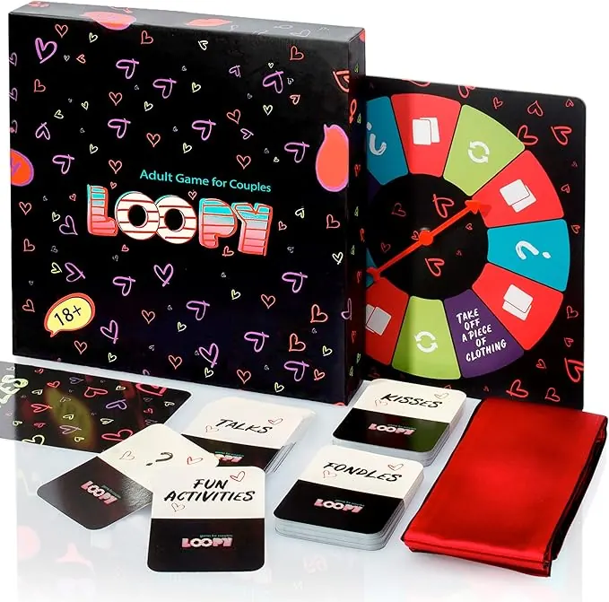 Loopy game set on white: box, spinner board, Talks, Kisses, Fun Activities and Fondles decks and a red satin blindfold